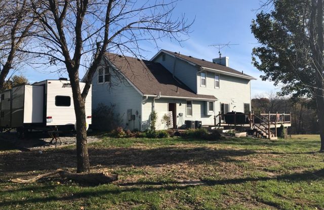 back side of house with old siding