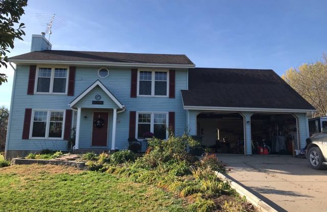 front of house with old siding