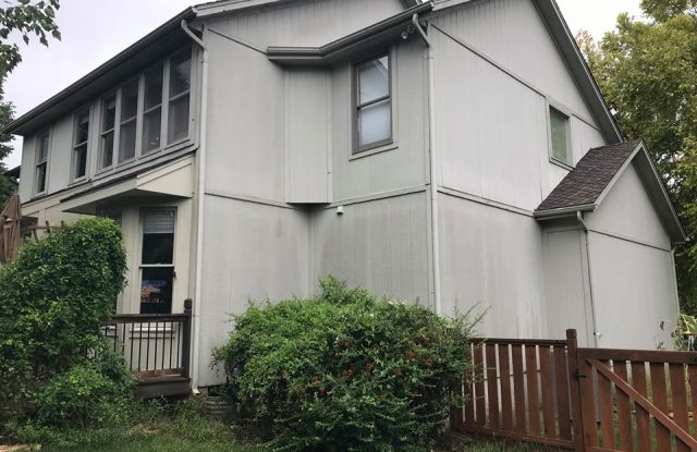 front of house with old siding