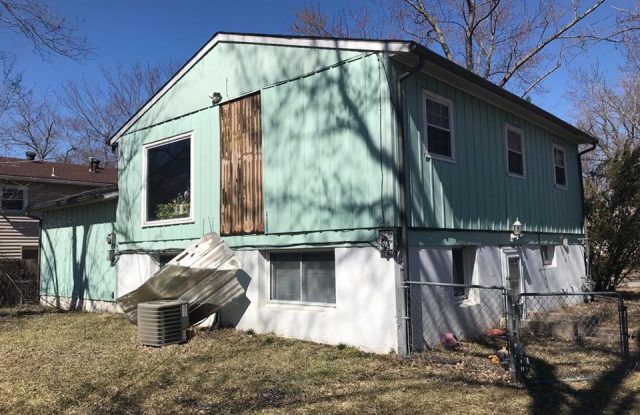 corner pic of house with old siding