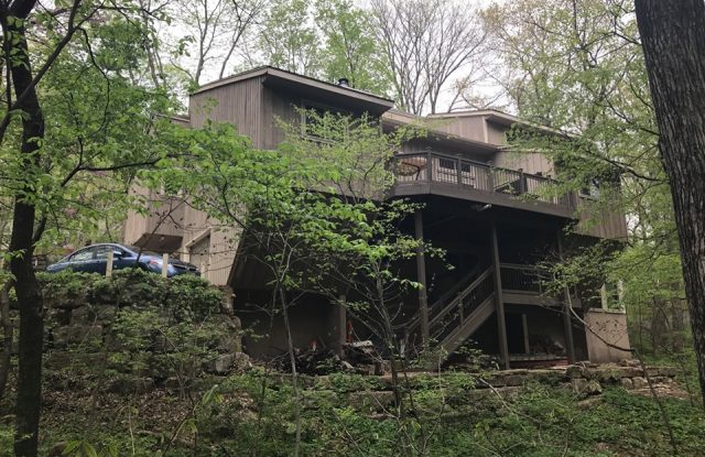 back of house with old siding