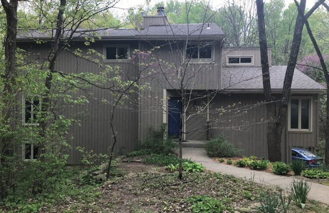 front of house with old siding