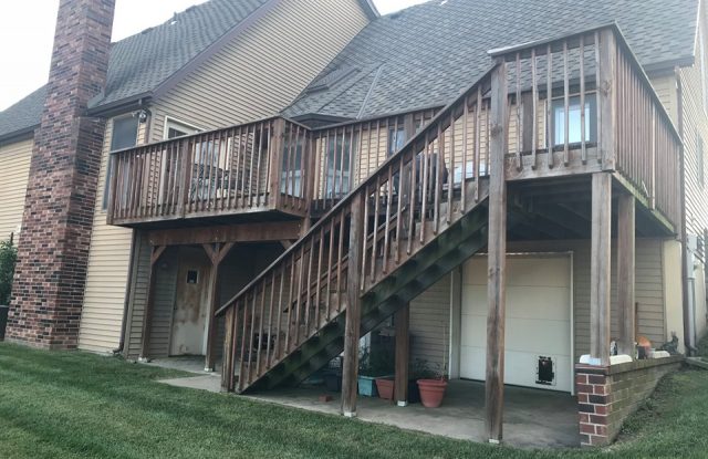 back of house with old siding