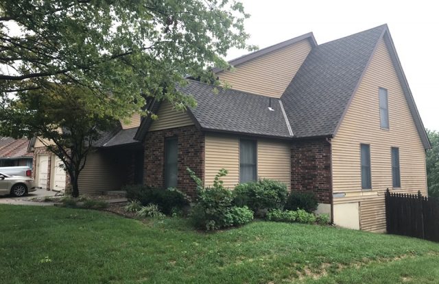 front of house with old siding