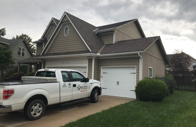 front of house with old siding