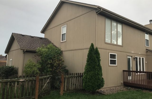 back of house with old siding