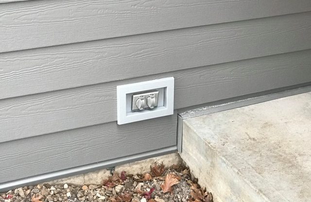 siding detail around power outlet
