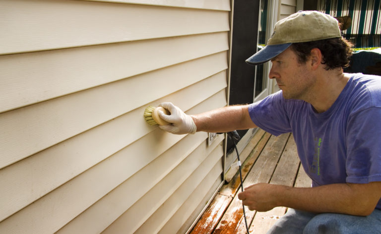 Siding being cleaned