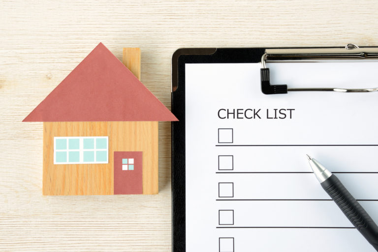 Graphic of a home with a checklist next to it