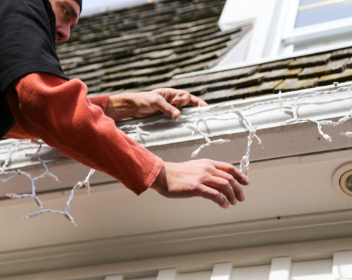 How to safely hang Christmas lights and protect your roof
