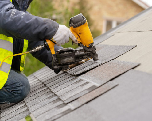Asphalt shingles being installed on a roof