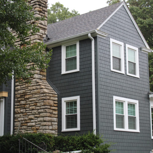 James Hardie Siding in Iron Gray with Arctic White trim installed on a Fairway, KS home by Smart Exteriors