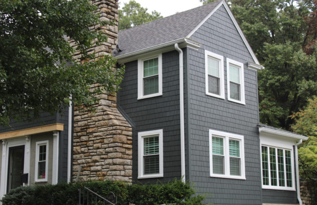 James Hardie Siding in Iron Gray with Arctic White trim installed on a Fairway, KS home by Smart Exteriors