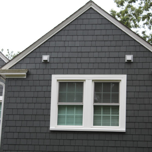 James Hardie Siding in Iron Gray with Arctic White trim installed on a Fairway, KS home by Smart Exteriors