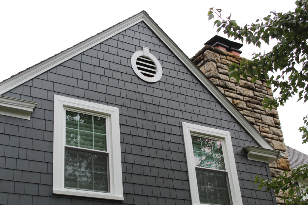 James Hardie Siding in Iron Gray with Arctic White trim installed on a Fairway, KS home by Smart Exteriors