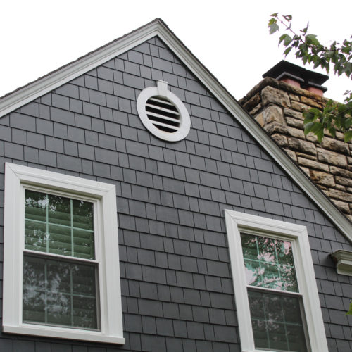 James Hardie Siding in Iron Gray with Arctic White trim installed on a Fairway, KS home by Smart Exteriors
