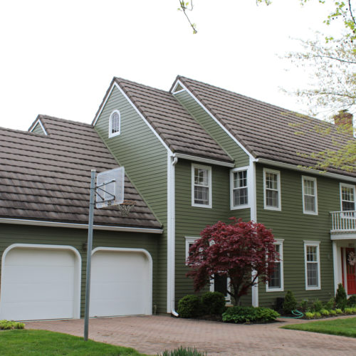 Home with olive green James Hardie Siding installed by Smart Exteriors in Overland Park, Kansas