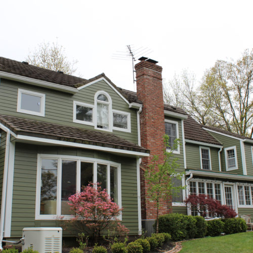 Home with olive green James Hardie Siding installed by Smart Exteriors in Overland Park, Kansas