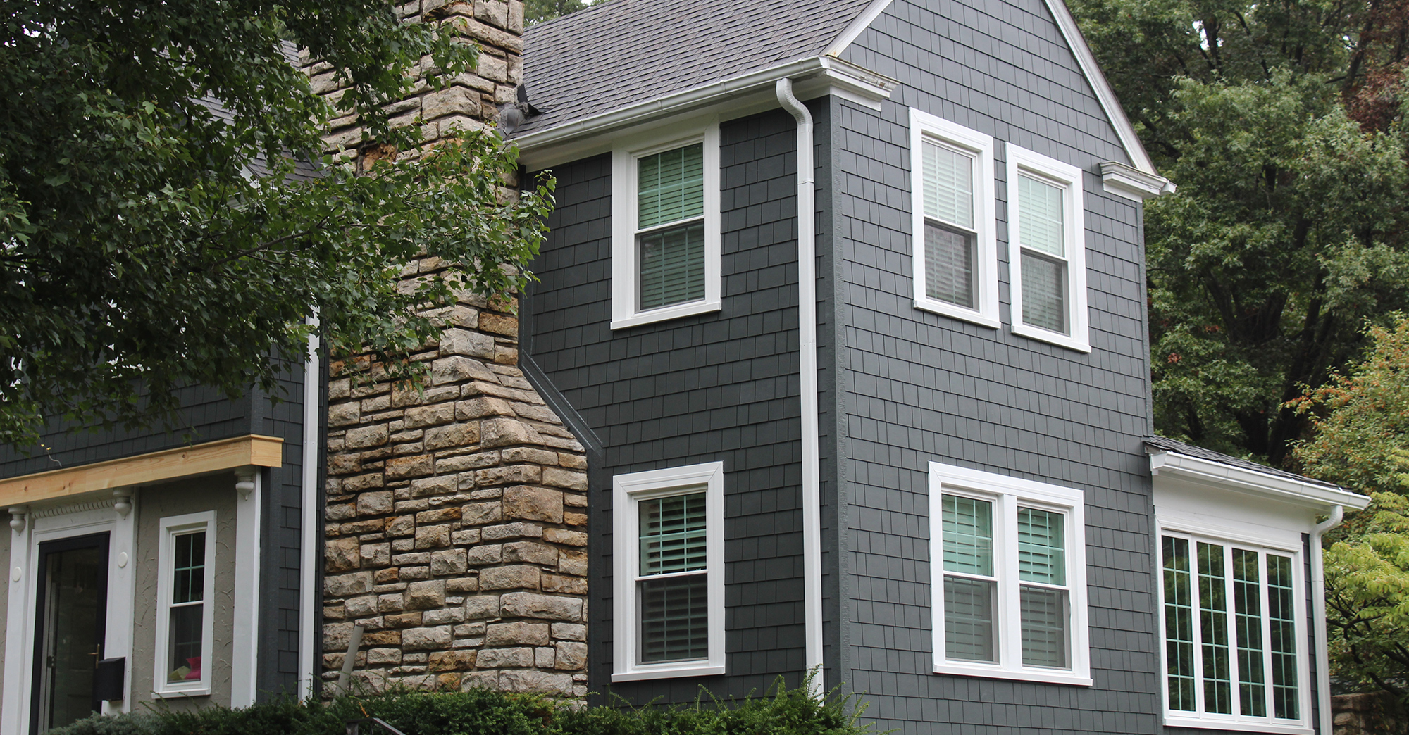 James Hardie Siding in Iron Gray with Arctic White trim installed on a Fairway, KS home by Smart Exteriors