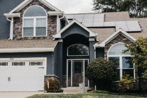 Lee's Summit Home with James Hardie Siding, ProVia Windows and Doors, and Stone Veneer Siding installed by Smart Exteriors.