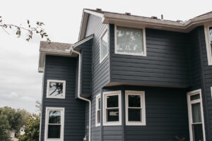 Lee's Summit Home with James Hardie Siding, ProVia Windows and Doors, and Stone Veneer Siding installed by Smart Exteriors.