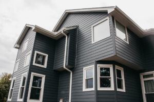 Lee's Summit Home with James Hardie Siding, ProVia Windows and Doors, and Stone Veneer Siding installed by Smart Exteriors.