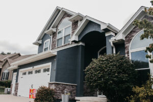 Lee's Summit Home with James Hardie Siding, ProVia Windows and Doors, and Stone Veneer Siding installed by Smart Exteriors.