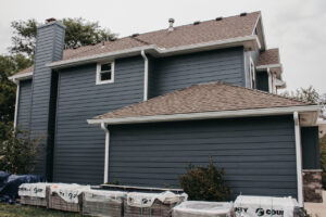 Lee's Summit Home with James Hardie Siding, ProVia Windows and Doors, and Stone Veneer Siding installed by Smart Exteriors.