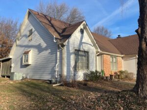 Smart Exteriors installs new Arctic White James Hardie Siding on Overland Park Home