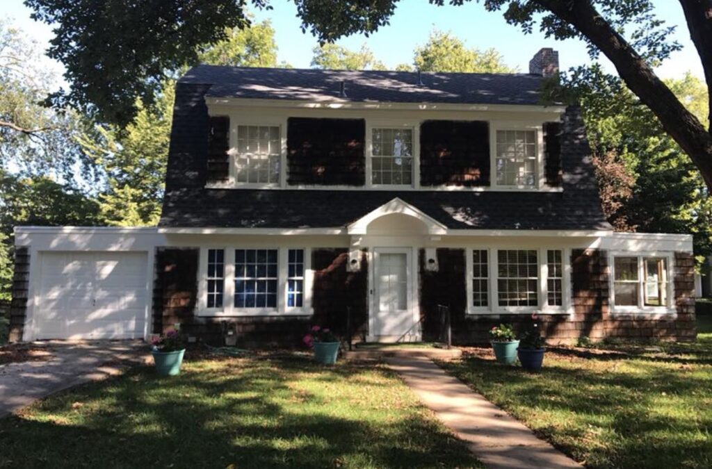 Smart Exteriors specialist performing siding replacement in Raymore, MO using high-quality tools and durable materials.